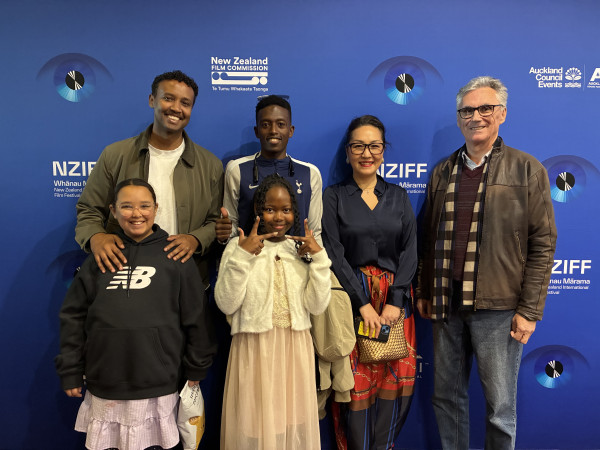 Six people pose for a photo in front of a New Zealand International Film Festival backdrop displaying NZIFF, New Zealand Film Commission and Auckland Council Events branding.