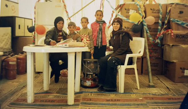 Shahen in Ruwaished camp with NGO staff 